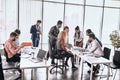 Crowded office room with hardworking people