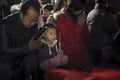 Crowded people kneel down and praying in temple