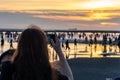 Crowded people playing the water in Gaomei Wetlands during sunset time