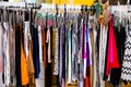 Crowded Rack of Clothes Hanging on Hangers Metal Store Display from Side Fashion Closet Royalty Free Stock Photo