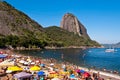 Crowded Red Beach with view of Sugarloaf Mountain in Rio de Janeiro, Brazil Royalty Free Stock Photo