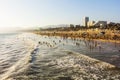 Crowded Santa Monica beach at sunset