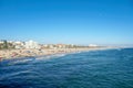 Crowded Santa Monica beach with tourist and families enjoying the summer