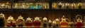 A crowded shelf overflows with an array of colorful bottles filled with various liquids, creating a vibrant and eclectic Royalty Free Stock Photo