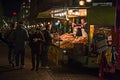 A crowded street food kiosk selling in the night of Milan Royalty Free Stock Photo