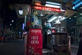 A crowded street food kiosk selling in the night of Milan Royalty Free Stock Photo