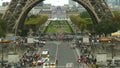 Crowded streets near the Eiffel tower base and Champ de Mars in Paris, France