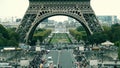 Crowded place near the Eiffel tower base and Champ de Mars in Paris, France