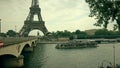 Crowded tour boat on the Seine River at the Eiffel Tower. Pont d'Iena bridge Royalty Free Stock Photo