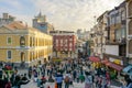 A crowded tourist square in front of Ruins of Saint Paul`s Church