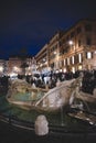 crowded tourists near Fontana della Barcaccia (fountain of the boat) at night Royalty Free Stock Photo