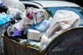 A crowded trash can filled with trash bags. Royalty Free Stock Photo