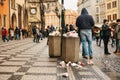 Prague, December 24, 2017: A crowded trash can on Prague`s main square during the christmas holidays. A lot of people in