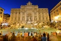 Crowded Trevi fountain (Fontana di Trevi) at night, Rome, Italy