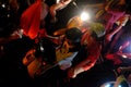 Crowded Vietnamese street at night, young people ride motorcycles in traffic jam Royalty Free Stock Photo