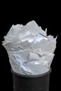 Dispose of paper in the office for modern and effective workflow presented with a full wastebasket