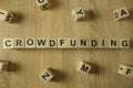 Crowdfunding word from wooden blocks