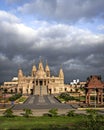 Crowdless Swaminarayan temple on a clear sunny day with clouds background in Ambegaon, Pune, Maharashtra, India