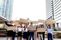 Crowds of discontented people holding blank banners placards protesting at downtown city, group of angry men and women rebellions Royalty Free Stock Photo