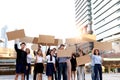 Crowds of discontented people holding blank banners placards protesting at downtown city, group of angry men and women rebellions Royalty Free Stock Photo