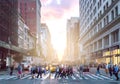 Crowds of diverse people cross the busy intersection on 23rd Street and 5th Avenue in New York City