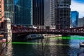 Crowds gather along Clark Street bridge over a Chicago River which is dyed green Royalty Free Stock Photo