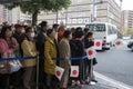 Crowds with paper flags waiting for the Japanese Emperor Akihito and his family in Kyoto