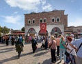 Crowds of pedestrians at Eminonu during the Victory Day holiday with Egyptian Bazaar in the background, Istanbul, Turkey