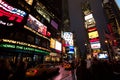 Crowds of peope under the electronic canyon that is Times Square, Manhattan Royalty Free Stock Photo