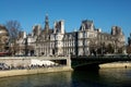 Crowds of people enjoying sunshine in winter on the Seine banks near the Hotel de Ville in Paris France