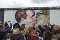Famous mural and people at the East Side Gallery in Berlin