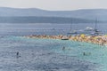 Crowds of people on Golden Cape beach. Golden Cape is the most famous beach in Croatia located on Brac island.