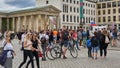 Crowds of tourists, shoppers and sightseers on Pariser Platz at Brandenburg Gate in Berlin, Germany