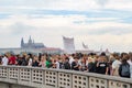 Crowds of people protesting again local ministry on a bridge with view of Prague castle Royalty Free Stock Photo