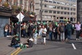 Crowds in the street in Irish top hats and green clothes in Dublin, Ireland on St. Patrick`s Day