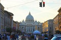 Crowds of people walk near the St Peter`s Basilica at the sunset in Rome, Italy. St Peter`s cathedral in Vatican City is one of Royalty Free Stock Photo