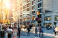 Crowds of people walking through the busy intersection on 14th Street at Union Square Park in New York City