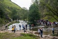 Crowds queuing to cross the famous stepping stones at river Dove Dovedale Royalty Free Stock Photo