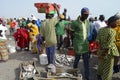 Crowds of sardinella fishers and fish buyers at Mbour landing site, Senegal