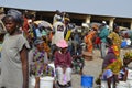 Crowds of sardinella fishers and fish buyers at Mbour landing site, Senegal