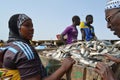 Crowds of sardinella fishers and fish buyers at Mbour landing site, Senegal