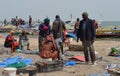 Crowds of sardinella fishers and fish buyers at Mbour landing site, Senegal