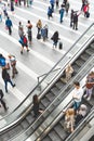 Crowds of shoppers and commuters on an escalator in Birmingham New Street Train Station