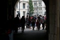 Crowds of tourists pass through archway at Horse Guards Parade in London, England.