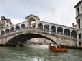 Crowds of tourists on Rialto Bridge and boats in the channel on September 24, 2010 in Venice Italy