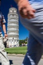Crowds of tourists visiting the Leaning Tower of Pisa
