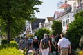 Crowds of tourists walk the quaint streets of this German tourist northern shore town on this sunny hot day