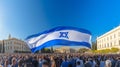 Crowds wave Israeli Star of David flags at a pro-Israel solidarity rally. Generative AI Royalty Free Stock Photo