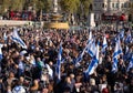 Crowds waving Israeli flags at pro-Israel rally in Trafalgar Square, central London, calling on Hamas to release the hostages.