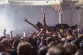 Crowdsurfing at a rock concert Royalty Free Stock Photo